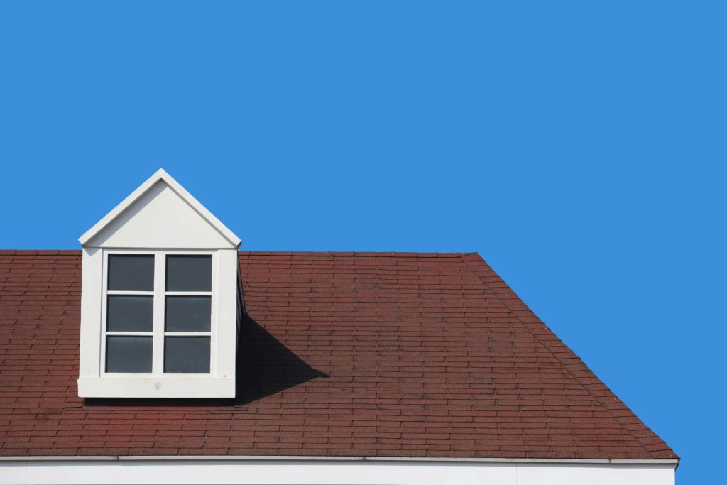 modern gable roof design house wall with clear blue sky background